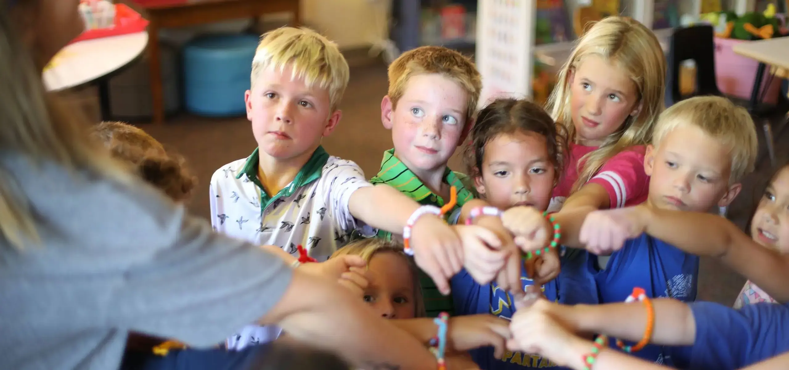 Students showing off friendship bracelets