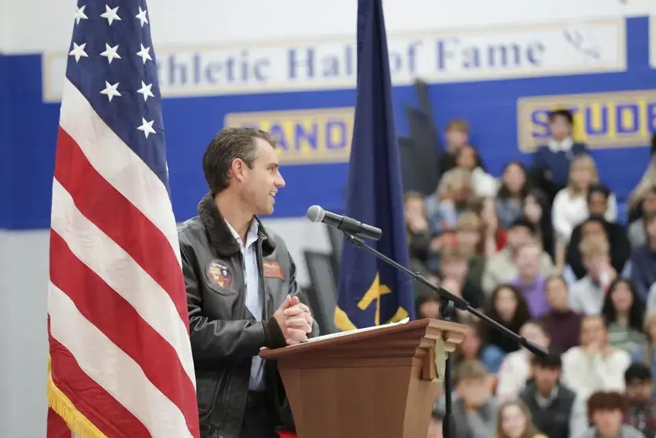 Alumni speaker at the Veterans Day assembly