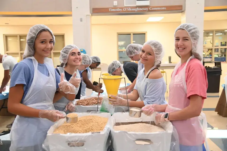 Upper School students volunteer to prepare meals for the less fortunate