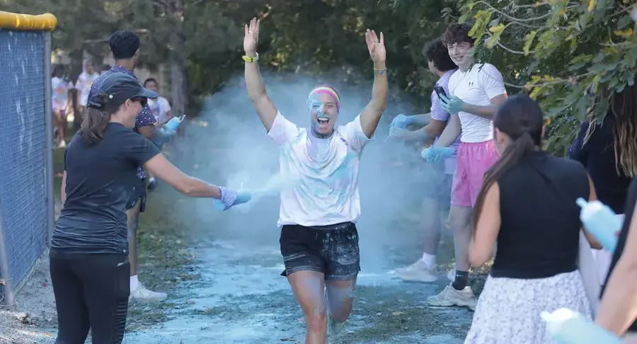 Middle school coach runs through the color run 5k 