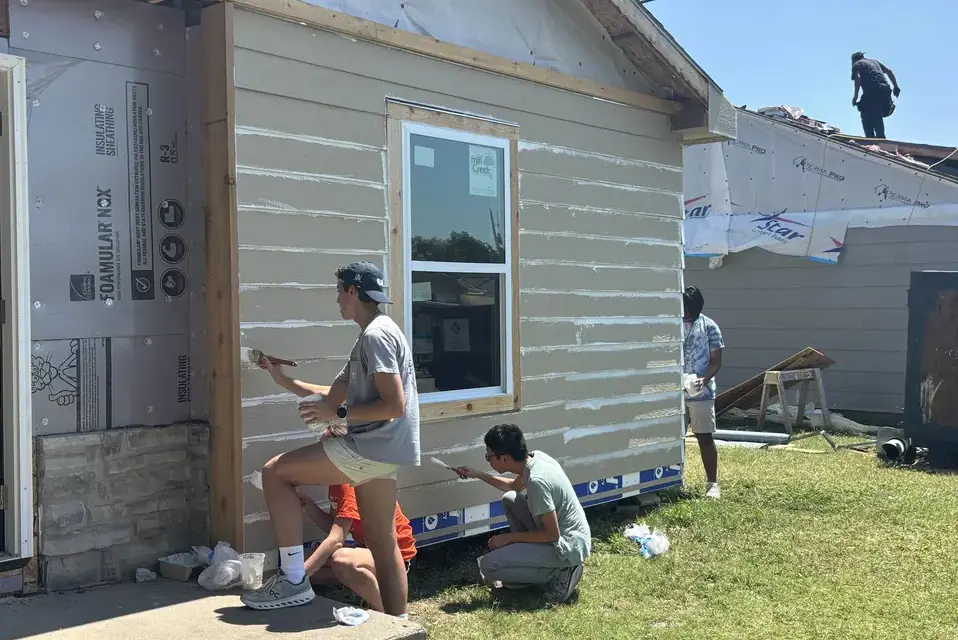 Upper school students volunteer to paint houses for Habitat for Humanity