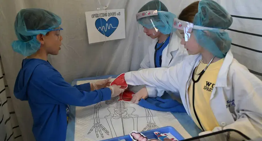 Students in medical class performing surgery