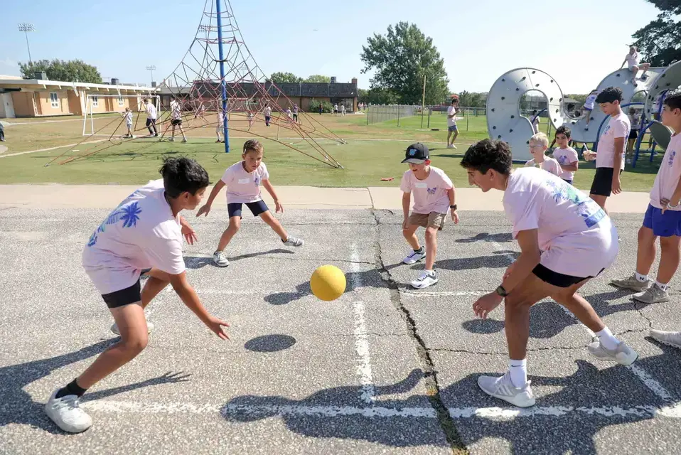 Lower and Middle School students playing together during Picnic Buddy Day