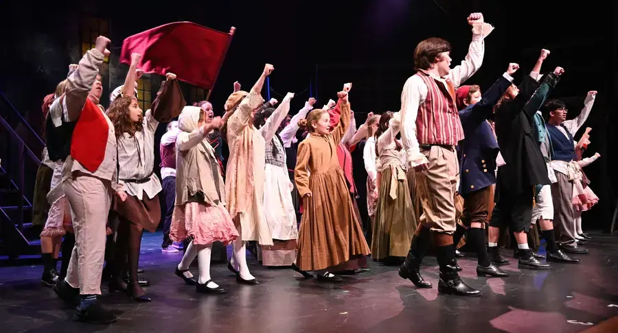 Middle and upper students perform Les Miserables