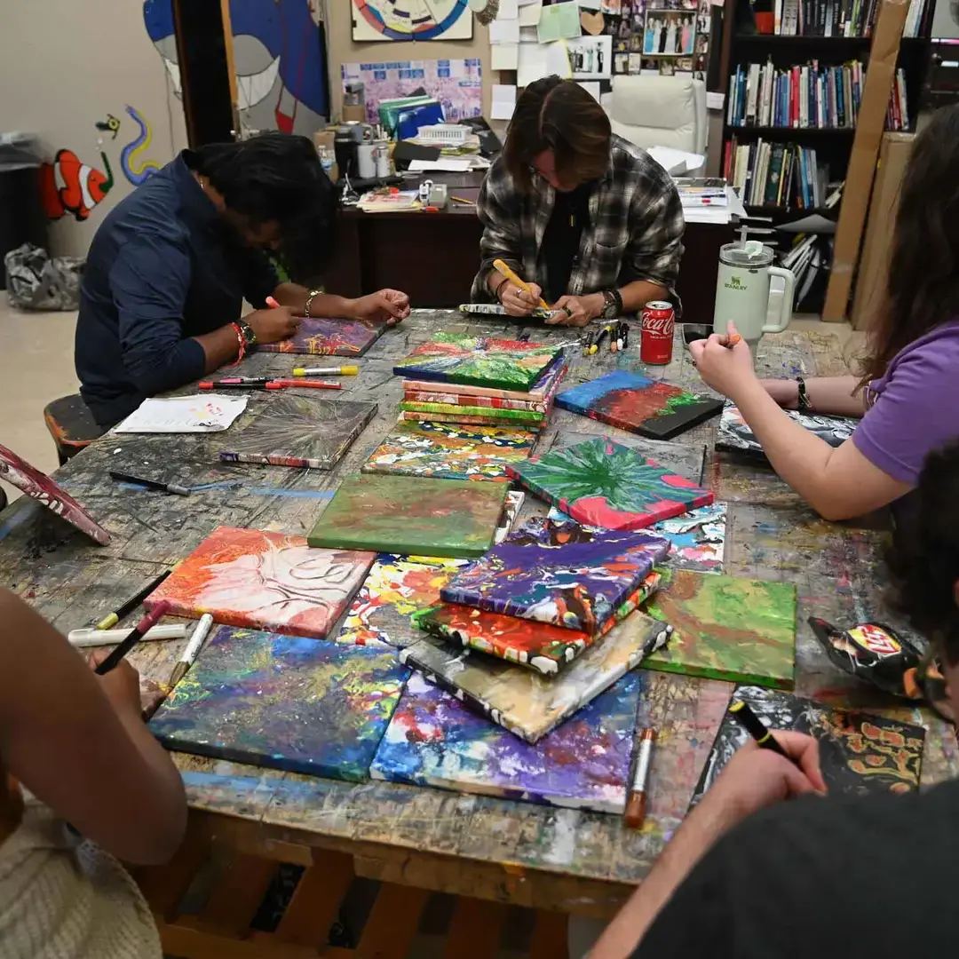 Students working on large art project
