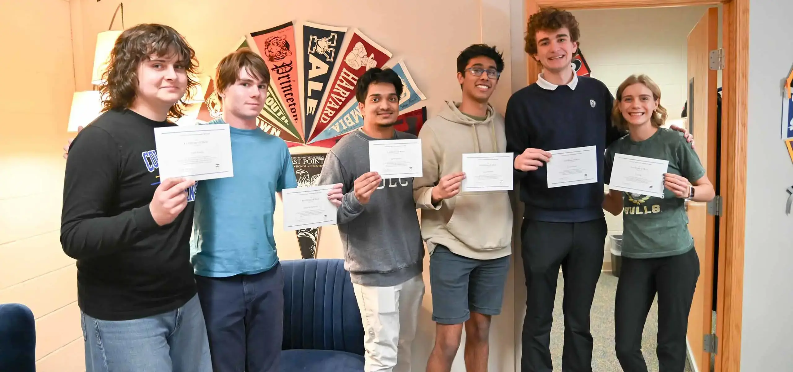 Students holding certificates
