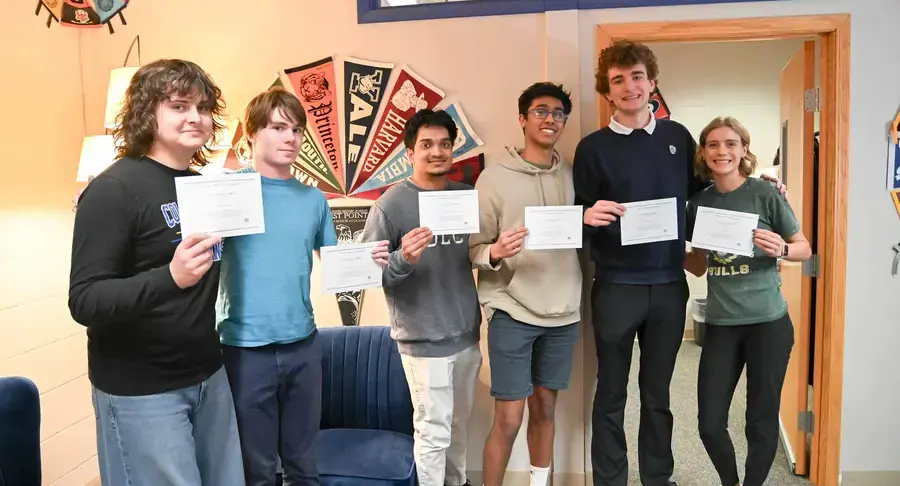 Students holding certificates