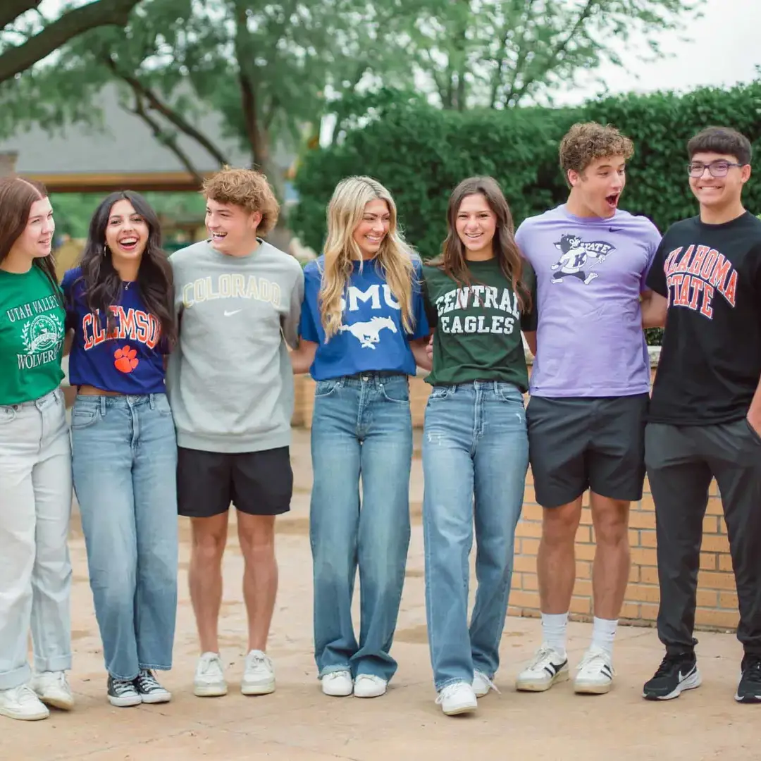 Upper school students wearing college shirts
