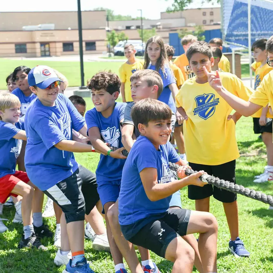 Middle school student playing tug of war